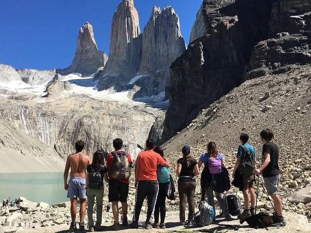 Group of hikers admiring the iconic granite peaks of Torres del Paine